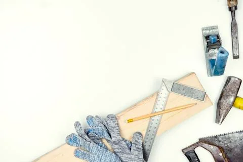 Set of carpentry tools over a white panel with space for text. Stock Photos
