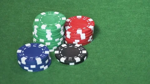 Set of casino chips on green table Stock Footage 70190441