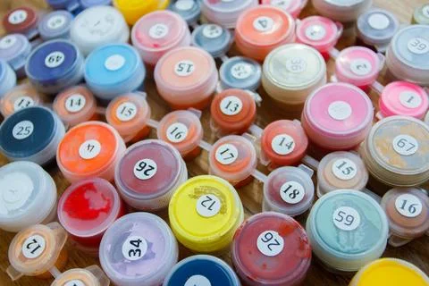 Set of cells with colored gouache. Concept of leisure, painting by numbers Stock Photos