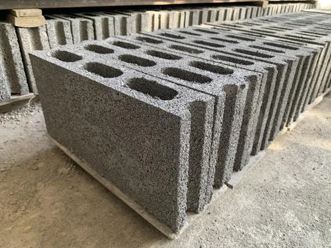 Set of cement block stacked in warehouse Stock Photos