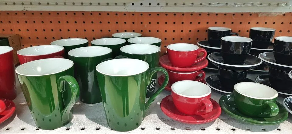 Set of ceramic cups for drinks and coffee or tea for breakfast Stock Photos