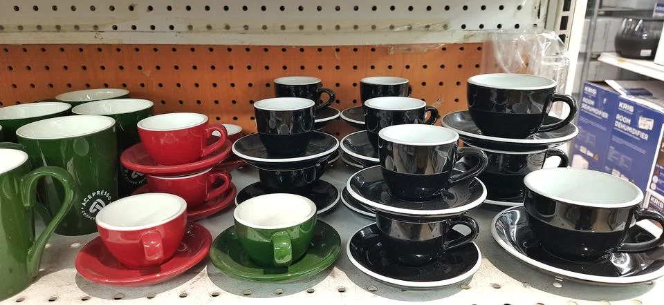 Set of ceramic cups for drinks and coffee or tea for breakfast Stock Photos