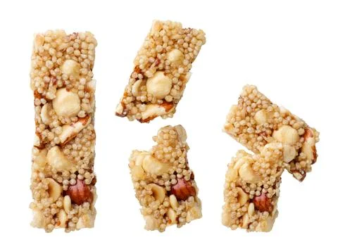 Set of cereal bars with nuts and a broken cut out on a white background. To.. Stock Photos