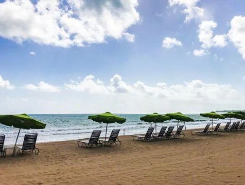 Set of chairs lined up at the beach Stock Photos