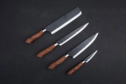 Set of chef's knives on a black background Stock Photos