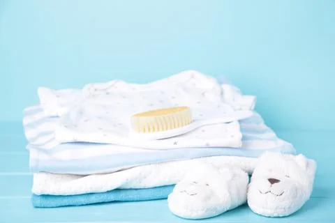 Set of children's clothes on a blue background Stock Photos