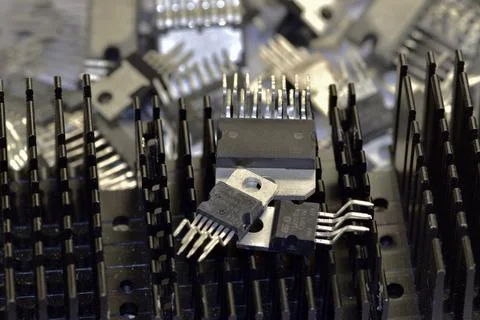 A set of chips of various audio-frequency power amplifiers against the backgr Stock Photos
