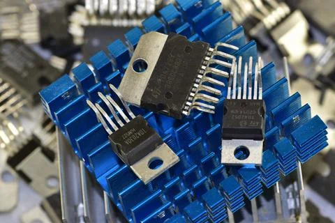 A set of chips of various audio-frequency power amplifiers against the backgr Stock Photos