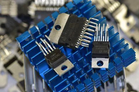 A set of chips of various audio-frequency power amplifiers against the backgr Stock Photos