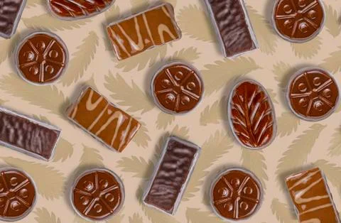 Set of chocolates on a dark background with a vegetable pattern, abstract bac Stock Photos