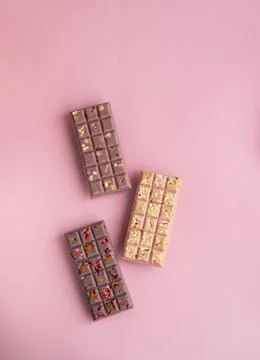 Set of chokolate bars on pink background Stock Photos