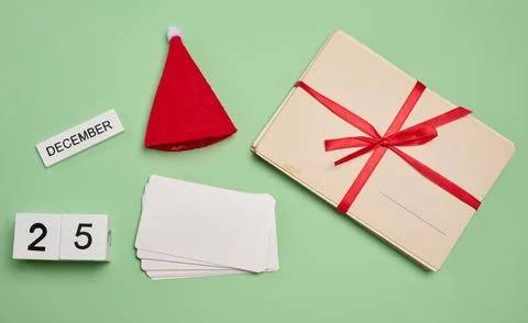 Set of Christmas elements: red Santa hat, cards, blank cards and calendar c.. Stock Photos