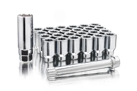A set of chrome-plated wheel nuts, wheel ten-beam nuts and a key adapter Stock Photos