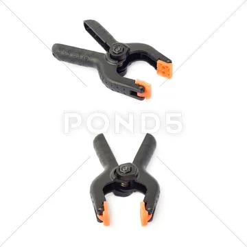 Set of Clamp with orange plastic jaws, isolated over the white background Stock Photos