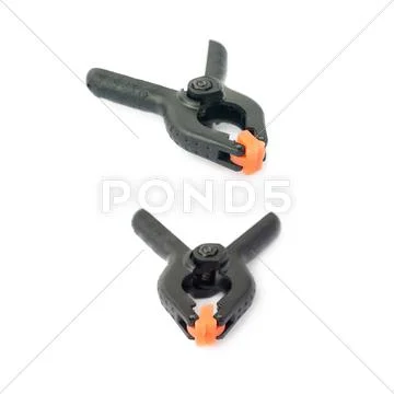 Set of Clamp with orange plastic jaws, isolated over the white background Stock Photos