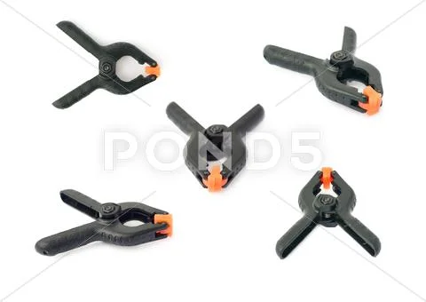 Set of Clamp with orange plastic jaws, isolated over the white background Stock Photos