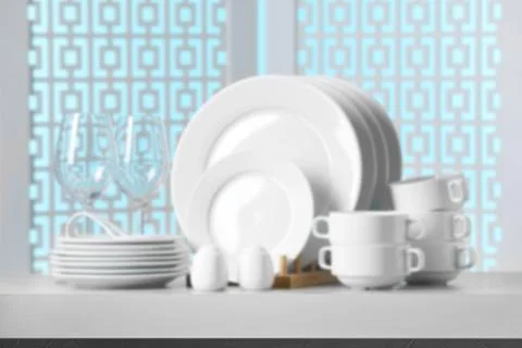 Set of clean dishware, focus on empty stone table Stock Photos