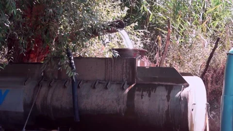 A set of clean drinking water in a tanker truck from a homemade waterfall. Stock Footage 167517270