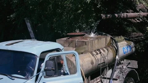 A set of clean drinking water in a tanker truck from a homemade waterfall. Stock Footage 167518467