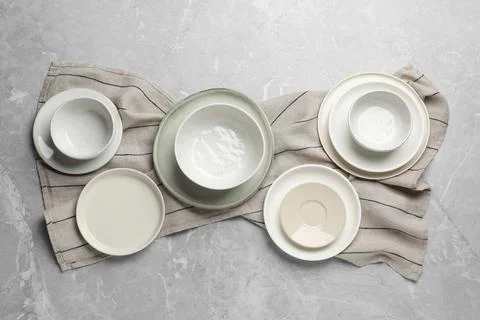 Set of clean tableware on grey table, flat lay Stock Photos