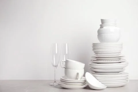 Set of clean tableware on white table Stock Photos