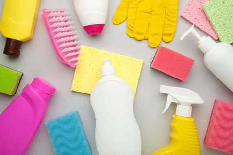 Set of cleaning tools on a grey background. Stock Photos