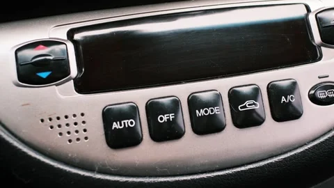 Set of close-up shots of a car interior featuring climate control buttons, .. Stock Footage 323179016