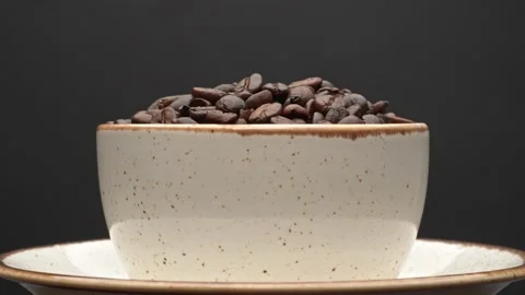 A set of coffee beans in cup on a black background. Stock Footage 221154265