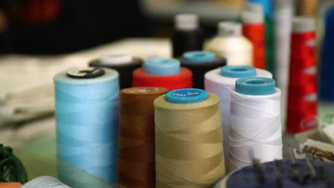 A set of coils with threads of different colors. Threads for industrial use Stock Footage 195024495