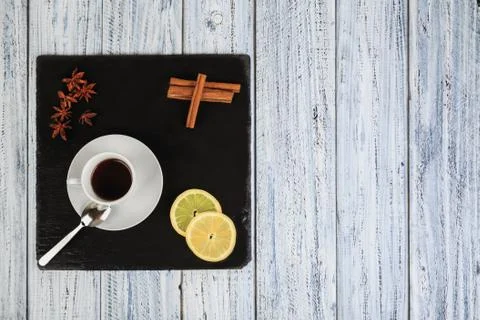 Set for cold winter evening: tea, lemon, cinnamon and star anise flowers Stock Photos