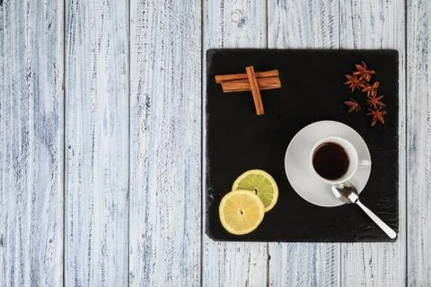 Set for cold winter evening: tea, lemon, cinnamon and star anise flowers Stock Photos