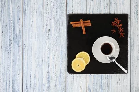 Set for cold winter evening: tea, lemon, cinnamon and star anise flowers Stock Photos
