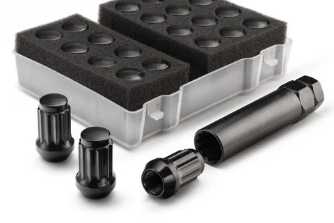 A set of colored black wheel nuts for wheels. auto tuning and car maintenance Stock Photos