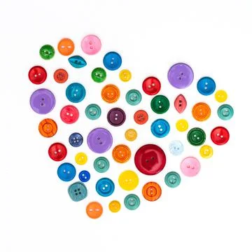 A set of colored buttons for needlework or sewing on a white background. Stock Photos