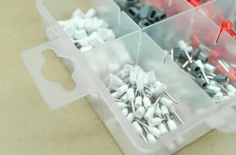 A set of colored crimp terminals for electrical wires. Crimping sleeves of Stock Photos