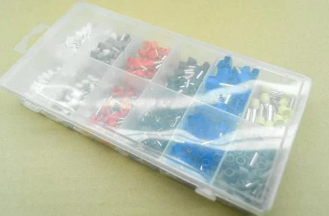 A set of colored crimp terminals for electrical wires. Crimping sleeves of Stock Photos