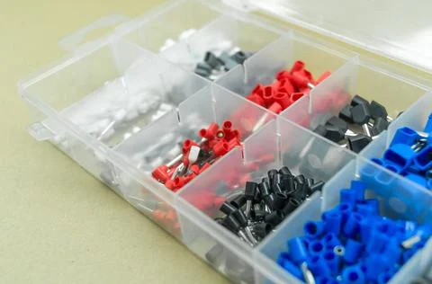 A set of colored crimp terminals for electrical wires. Crimping sleeves of Stock Photos