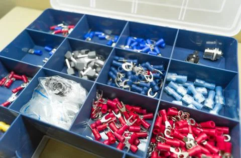 A set of colored crimp terminals for electrical wires. Crimping sleeves of Stock Photos