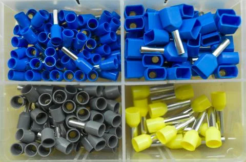 A set of colored crimp terminals for electrical wires. Crimping sleeves of Stock Photos