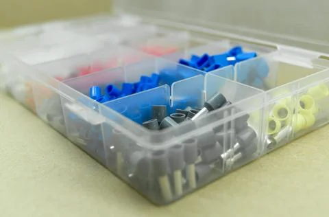 A set of colored crimp terminals for electrical wires. Crimping sleeves of Stock Photos