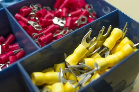 A set of colored crimp terminals for electrical wires. Crimping sleeves of Stock Photos