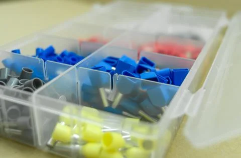A set of colored crimp terminals for electrical wires. Crimping sleeves of Stock Photos