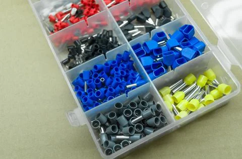 A set of colored crimp terminals for electrical wires. Crimping sleeves of Stock Photos