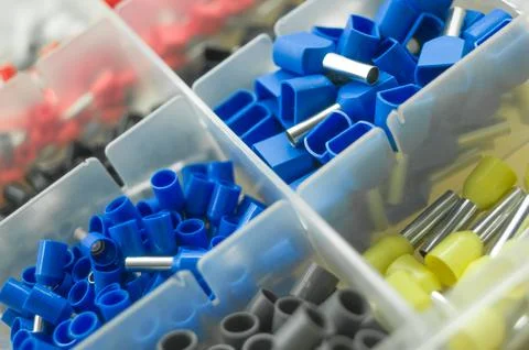A set of colored crimp terminals for electrical wires. Crimping sleeves of Stock Photos