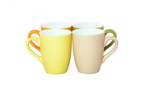 Set of colored cups isolated on white background Fotos de archivo