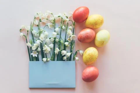 Set of colored eggs and flowers in the envelope Stock Photos