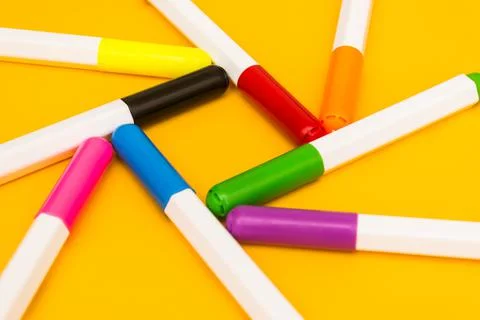 A set of colored markers is built in the shape of a star. An interesting form Stock Photos