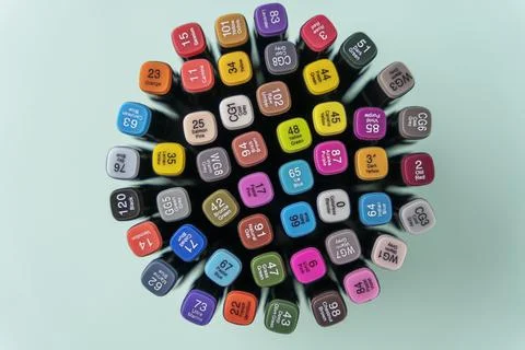 A set of colored markers, multi-colored markers, a top view on a turquoise ba Stock Photos