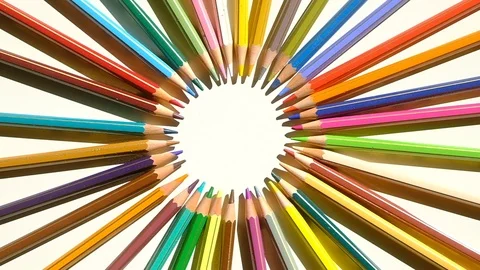 Set of colored pencils arranged in a circle on a white background Video stock 126920928