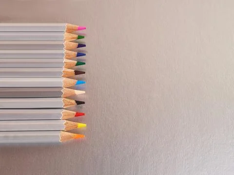 A set of colored pencils on a gray background. Stationery for creativity an.. Stock Photos